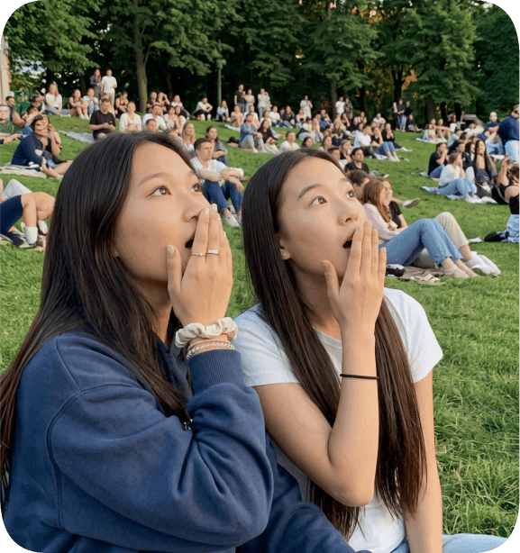 Students on a university campus lawn